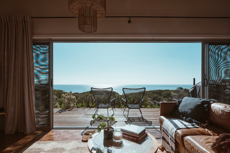 a terrace of a modern villa overlooking the ocean